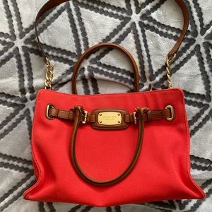 Michael Kors orange canvas handbag